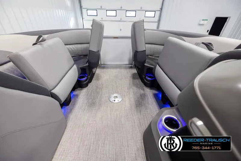 Slide: The Image of 2025 Avalon LSZ QLS boat interior with gray seating and blue LED cup holders. - 19