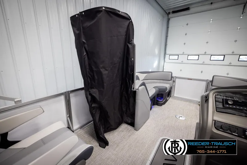 Slide: The Image of Interior of 2025 Avalon LSZ QLS boat with seating and privacy curtain. - 22