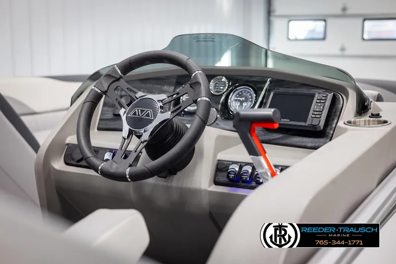 Slide: The Image of 2025 Avalon LSZ QLS boat dashboard with steering wheel and control panel. - 26