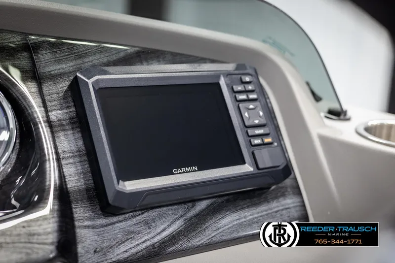 Slide: The Image of Garmin display on 2025 Avalon LSZ QLS boat dashboard, Reeder-Trausch Marine branding. - 32