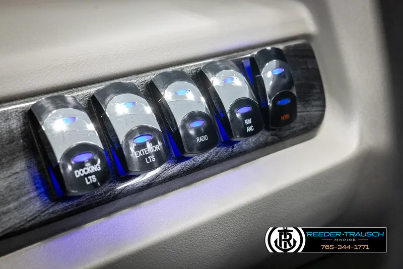 Slide: The Image of Control panel with illuminated switches in 2025 Avalon LSZ QLS boat. - 33