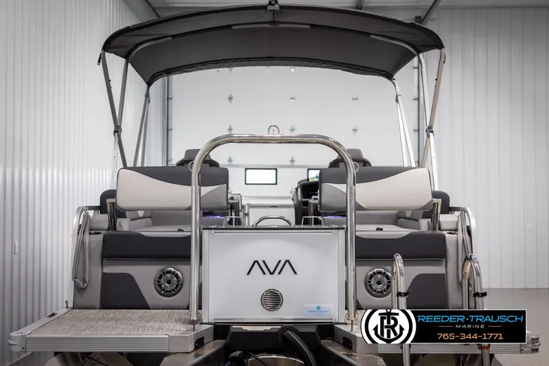 Slide: The Image of 2025 Avalon LSZ QLS pontoon boat with canopy in a showroom. - 7