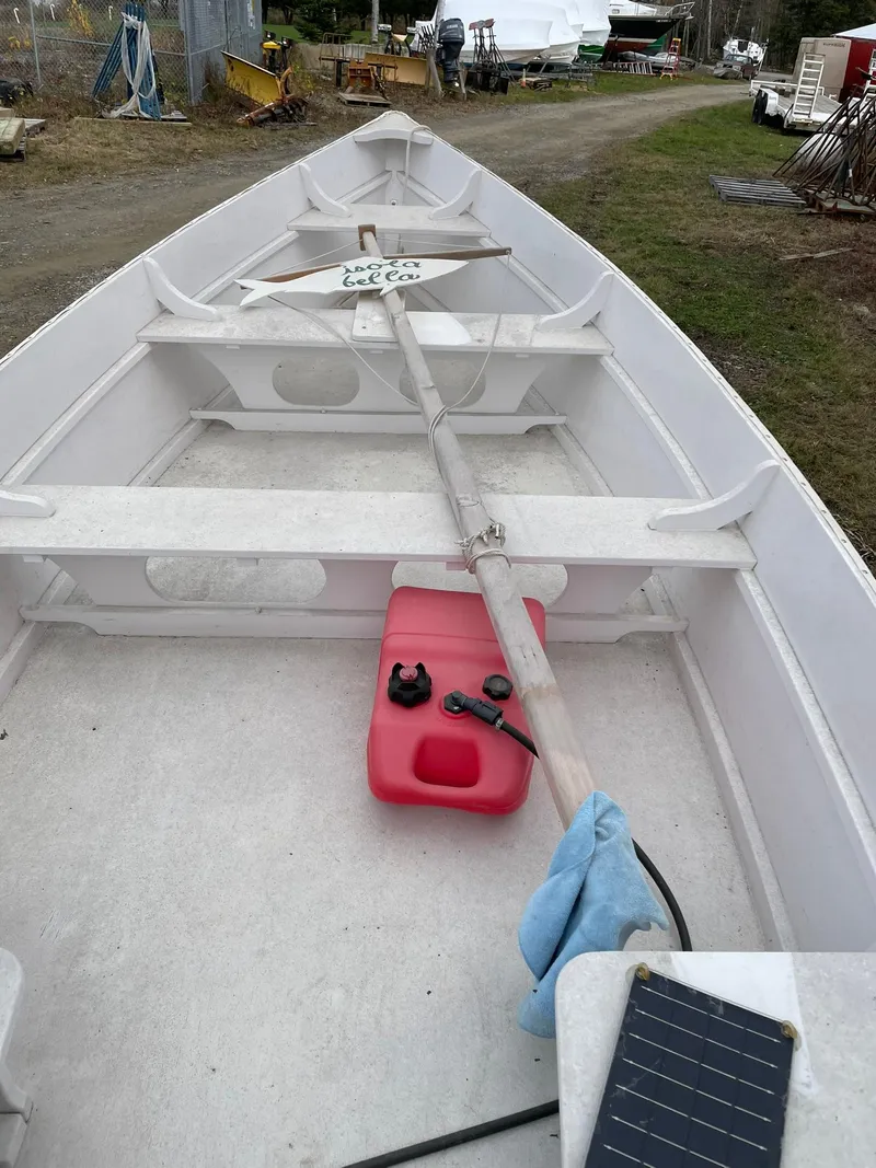 Slide: The Image of 2017 Rossiter Estate Skiff interior with oar and red fuel tank on deck. - 13