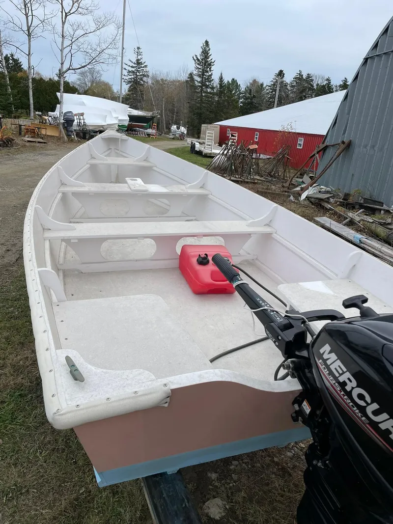 Slide: The Image of 2017 Rossiter Estate Skiff with Mercury outboard motor, docked outdoors. - 5