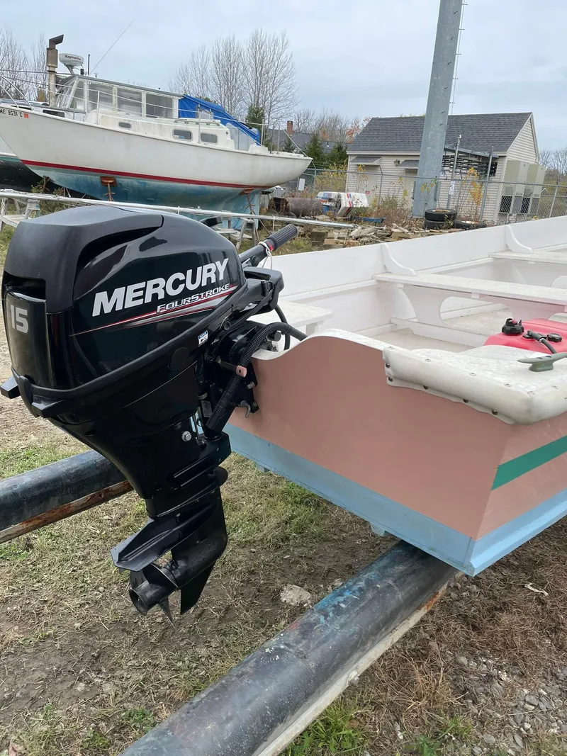 Slide: The Image of 2017 Rossiter Estate Skiff with Mercury outboard motor on trailer. - 7