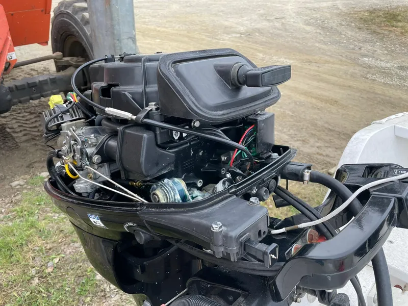 Slide: The Image of Close-up of a 2017 Rossiter Estate Skiff outboard motor, showcasing engine components. - 8