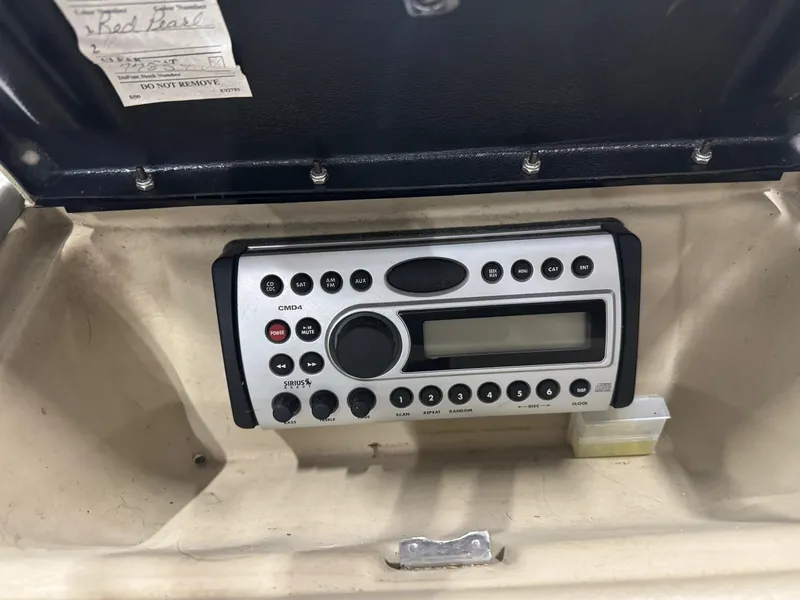 Slide: The Image of Boat stereo system in a 2007 Larson LXi 208 dashboard compartment. - 9