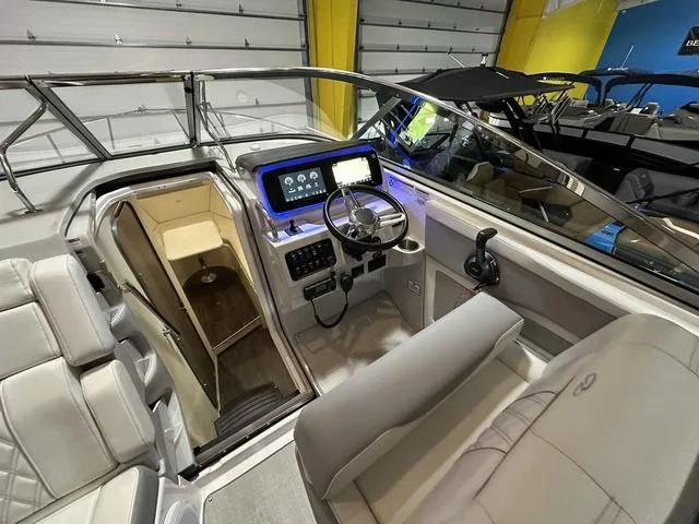 Slide: The Image of 2022 Regal 28 Express boat interior with modern dashboard and seating. - 15