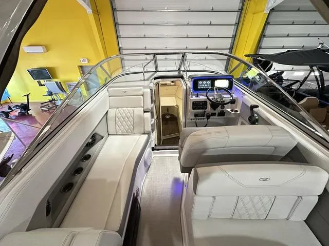 Slide: The Image of 2022 Regal 28 Express boat interior with modern dashboard and seating. - 18