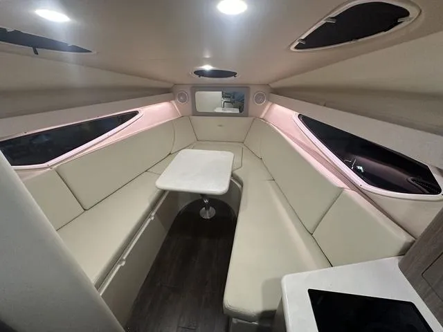 Slide: The Image of 2022 Regal 28 Express cabin interior with modern seating and table. - 27