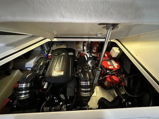 Slide: The Image of Engine compartment of 2022 Regal 28 Express boat, showcasing mechanical components and layout. - 6