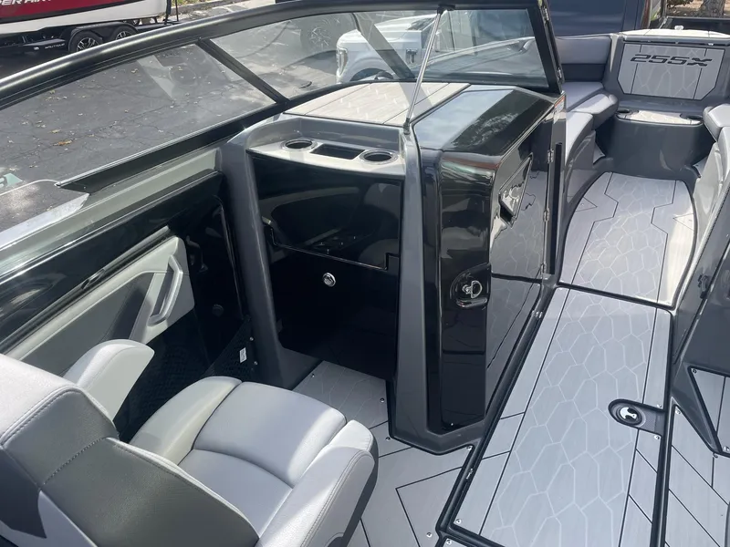Slide: The Image of 2025 Yamaha Boats 255XE interior with sleek seating and modern design. - 10