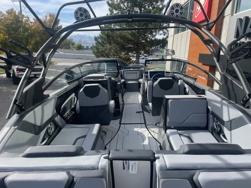 Slide: The Image of 2025 Yamaha Boats 255XE interior, showcasing sleek seating and modern design. - 4