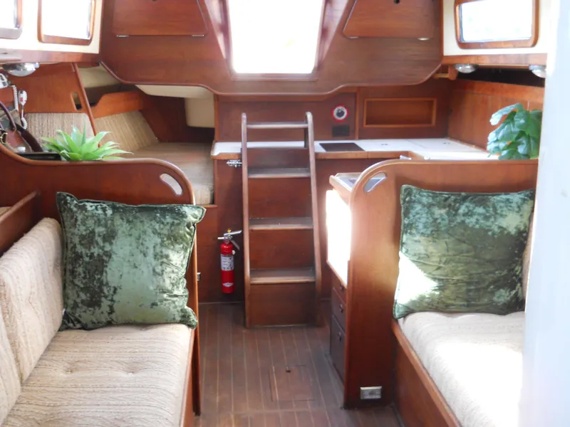 Slide: The Image of Interior of 1985 Sabre 38 MK I sailboat with wooden finish and green cushions. - 16