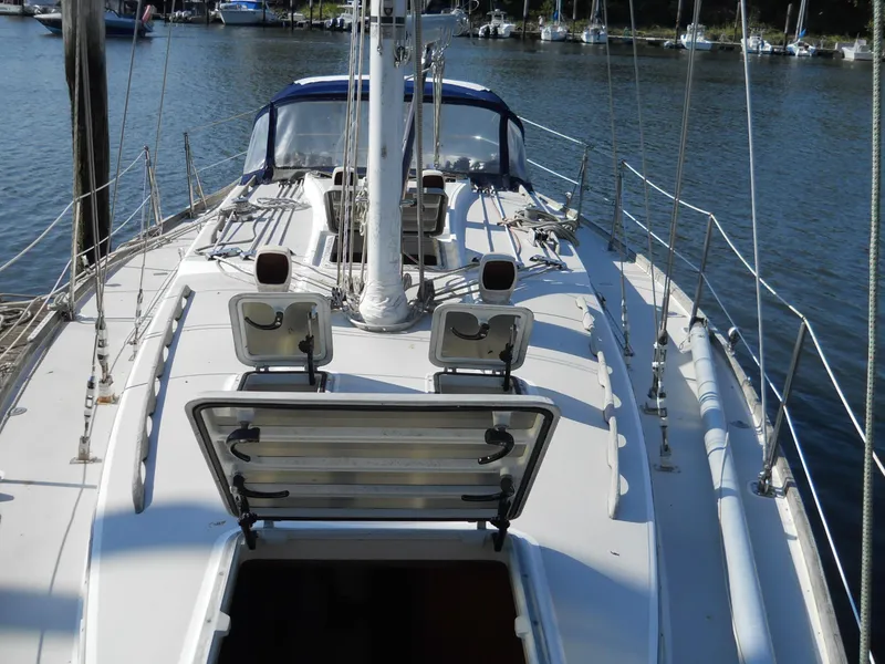 Slide: The Image of 1985 Sabre 38 MK I sailboat deck with open hatch, docked in marina. - 22