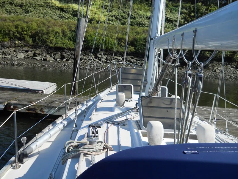 Slide: The Image of 1985 Sabre 38 MK I sailboat docked, showing deck and rigging details. - 24