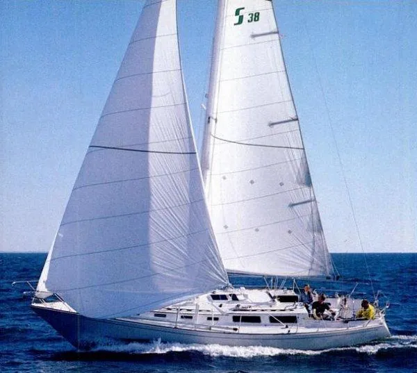Slide: The Image of 1985 Sabre 38 MK I sailboat gliding on open sea with full sails. - 25