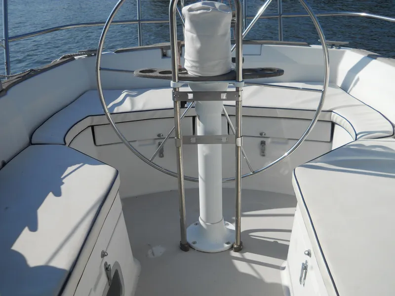 Slide: The Image of Cockpit of 1985 Sabre 38 MK I sailboat with cushioned seating and steering wheel. - 5