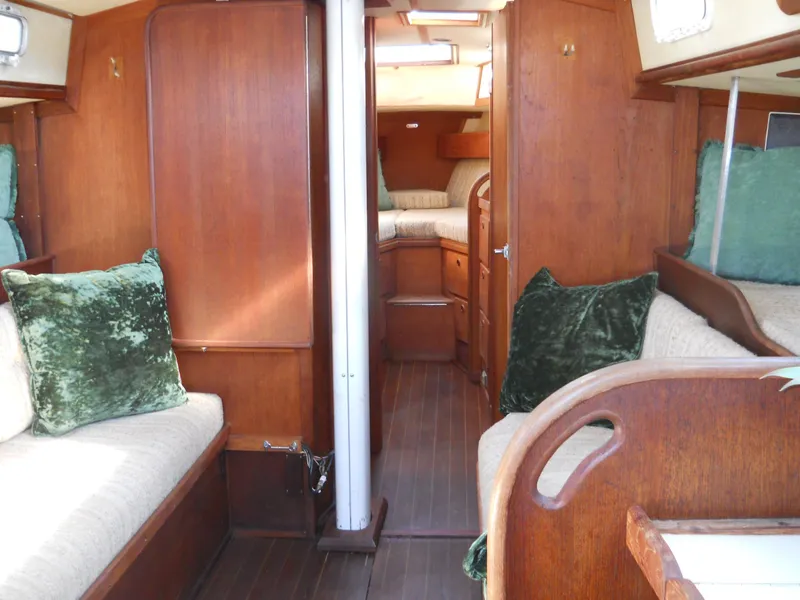 Slide: The Image of Interior of 1985 Sabre 38 MK I sailboat with wood finish and green cushions. - 6