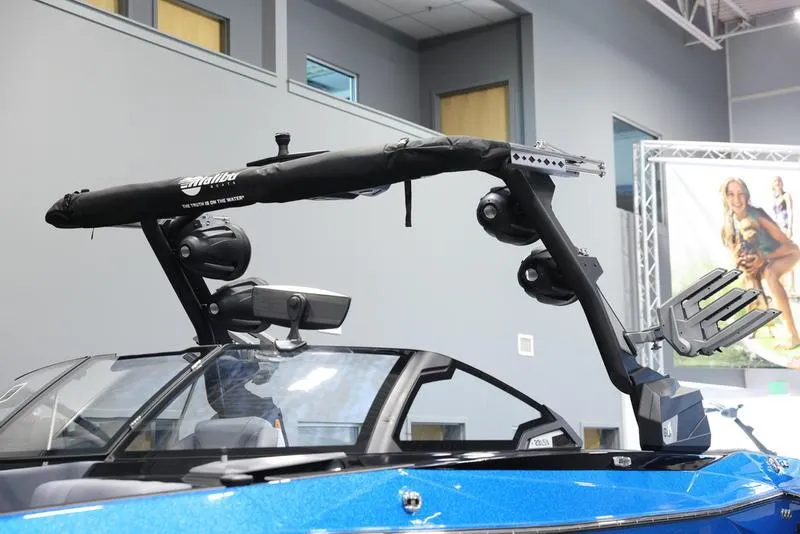 Slide: The Image of 2024 Malibu 23 LSV boat with wakeboard tower in showroom. - 10