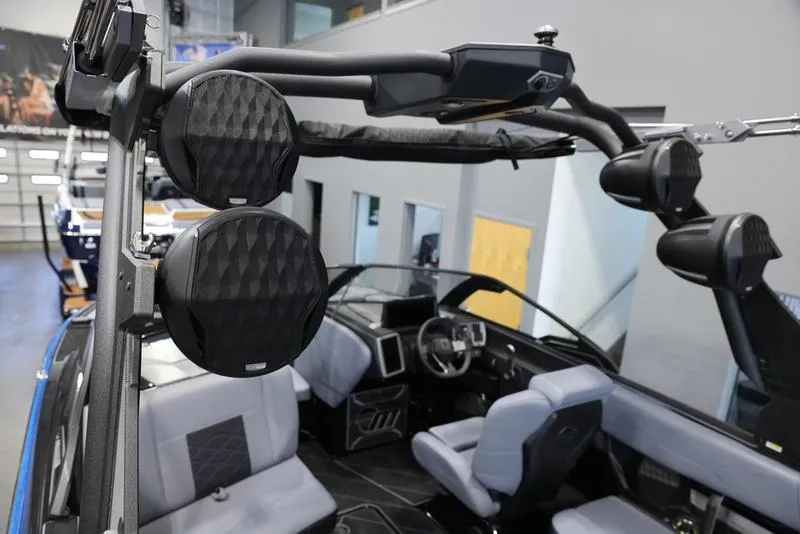 Slide: The Image of 2024 Malibu 23 LSV boat interior with premium audio system and modern seating. - 13