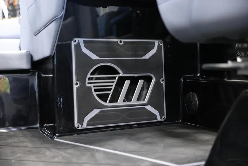 Slide: The Image of 2024 Malibu 23 LSV interior detail with sleek black and silver design elements. - 14