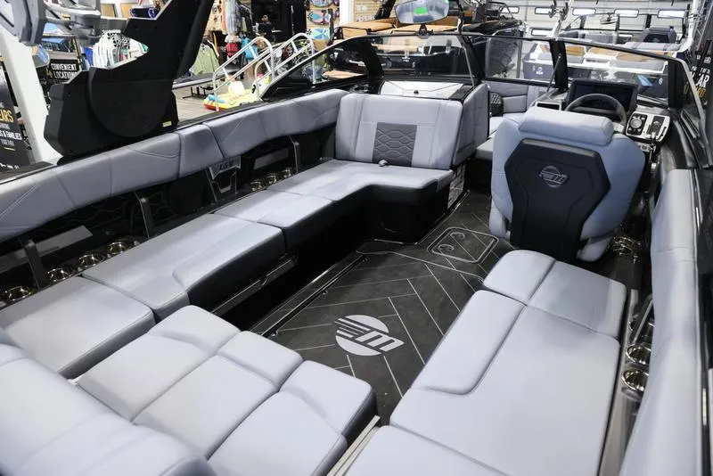 Slide: The Image of 2024 Malibu 23 LSV boat interior with luxurious seating and modern design. - 21