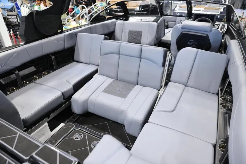 Slide: The Image of 2024 Malibu 23 LSV boat interior with luxurious gray seating and modern design. - 22