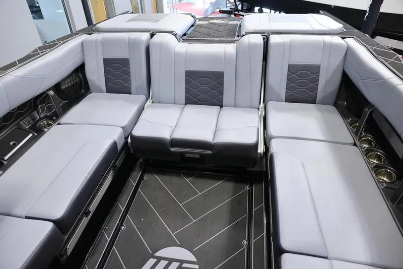 Slide: The Image of 2024 Malibu 23 LSV boat interior with gray seating and modern design. - 27
