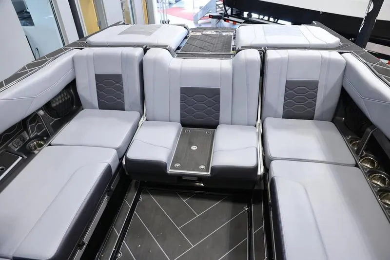 Slide: The Image of 2024 Malibu 23 LSV boat interior with luxurious gray seating and modern design. - 28