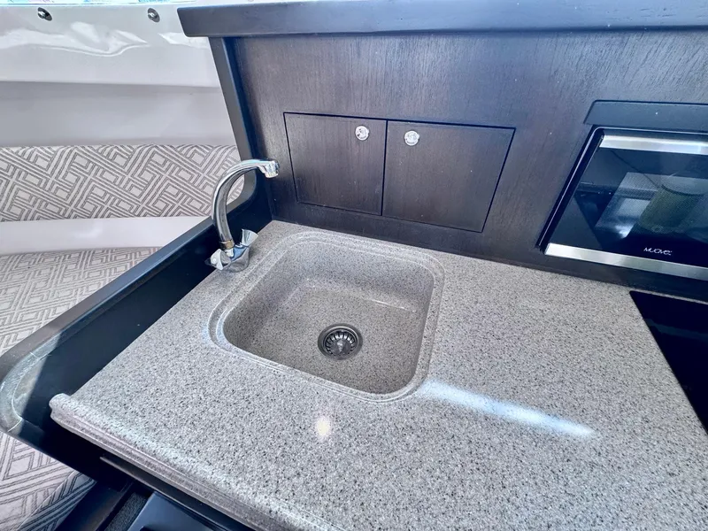 Slide: The Image of Modern kitchen sink in 2022 Stamas 370 Aegean boat with sleek countertop design. - 10