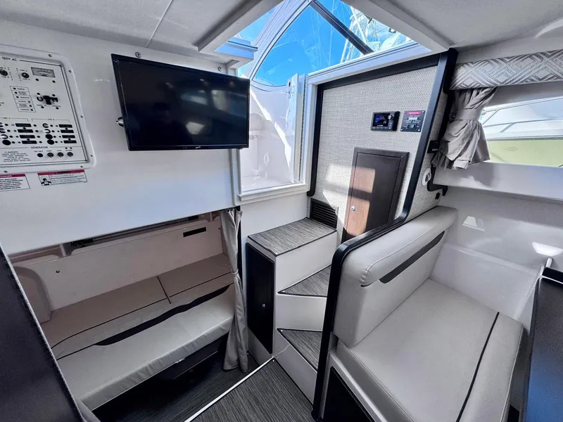 Slide: The Image of Interior of 2022 Stamas 370 Aegean boat with seating, TV, and control panel. - 19