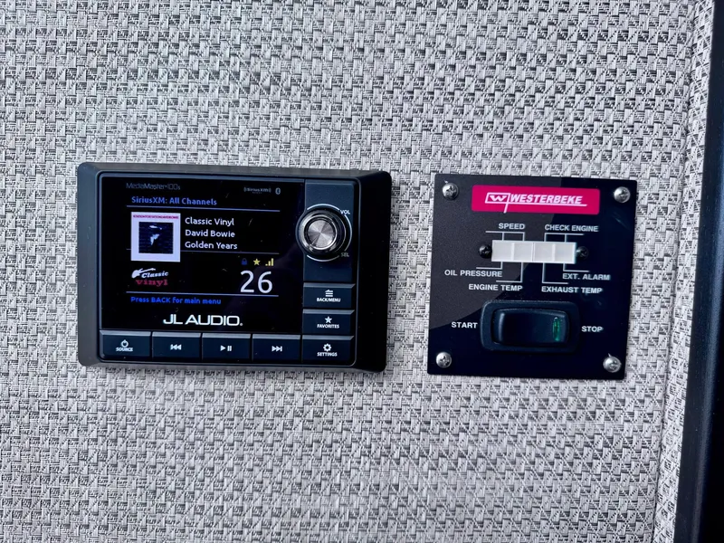 Slide: The Image of JL Audio and Westerbeke control panels on 2022 Stamas 370 Aegean boat. - 24