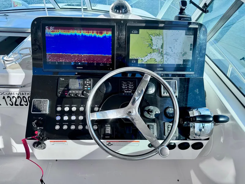 Slide: The Image of Stamas 370 Aegean 2022 helm with dual navigation screens and steering wheel. - 25