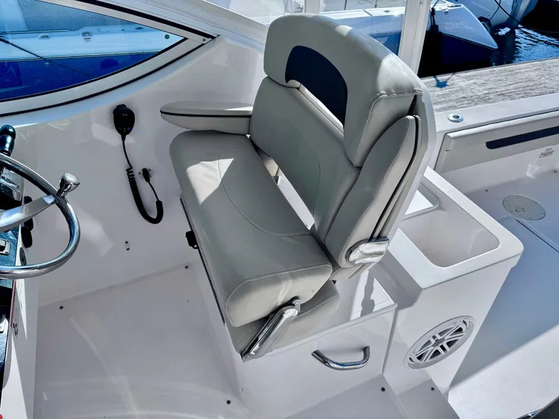 Slide: The Image of Stamas 370 Aegean 2022 boat interior with helm seat and steering wheel. - 37