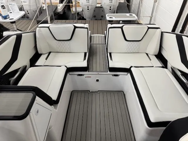 Slide: The Image of 2025 Yamaha Boats 252SD interior with white and black seating, modern design. - 13