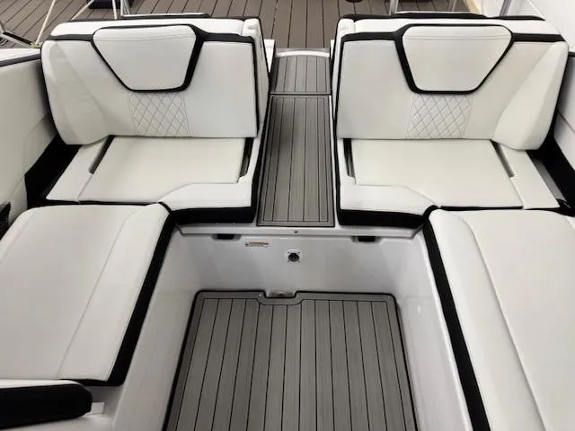 Slide: The Image of 2025 Yamaha Boats 252SD interior with white cushioned seating and sleek design. - 15