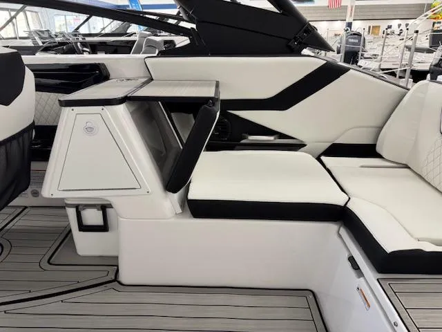 Slide: The Image of 2025 Yamaha Boats 252SD interior with sleek white and black seating design. - 20