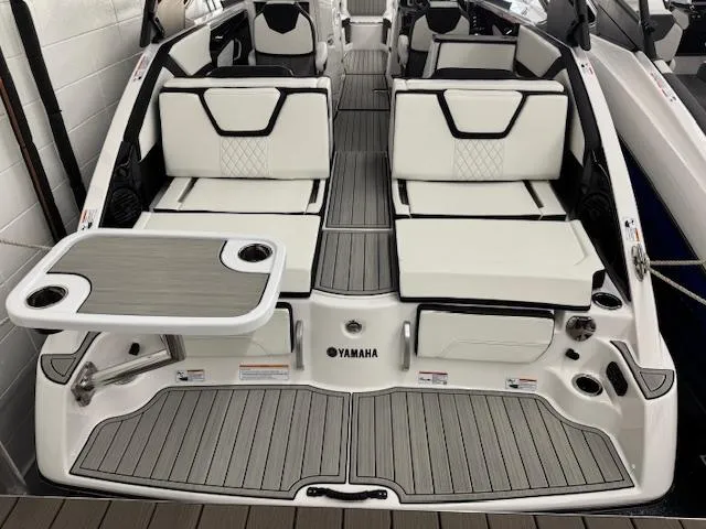 Slide: The Image of 2025 Yamaha Boats 252SD interior with sleek seating and table setup. - 22