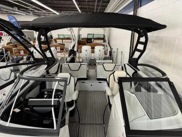 Slide: The Image of 2025 Yamaha Boats 252SD interior with sleek seating and modern design in showroom. - 3