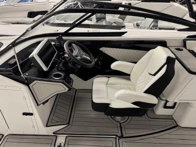 Slide: The Image of 2025 Yamaha Boats 252SD interior with sleek white seating and modern dashboard. - 4