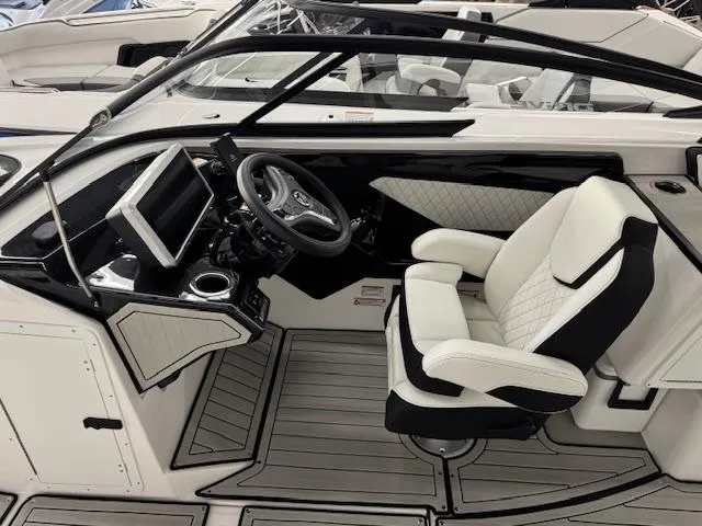 Slide: The Image of 2025 Yamaha Boats 252SD cockpit with modern steering and seating. - 5