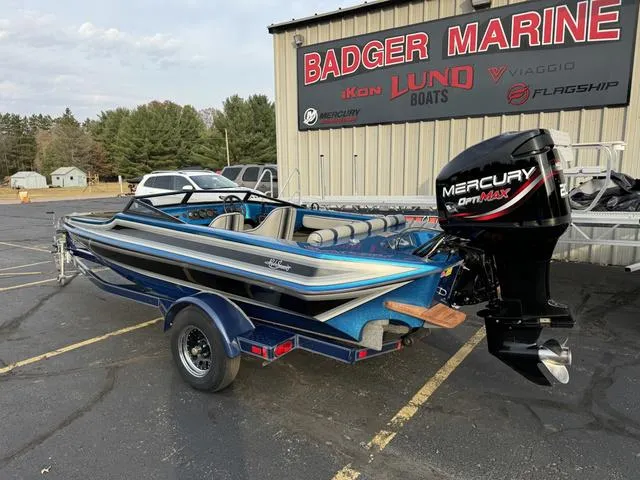 Slide: The Image of 1989 Hydrostream Vegas XT boat with Mercury OptiMax engine at Badger Marine dealership. - 13