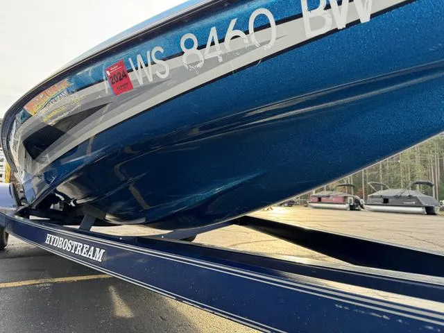 Slide: The Image of 1989 Hydrostream Vegas XT boat on trailer, blue hull, registration visible. - 15