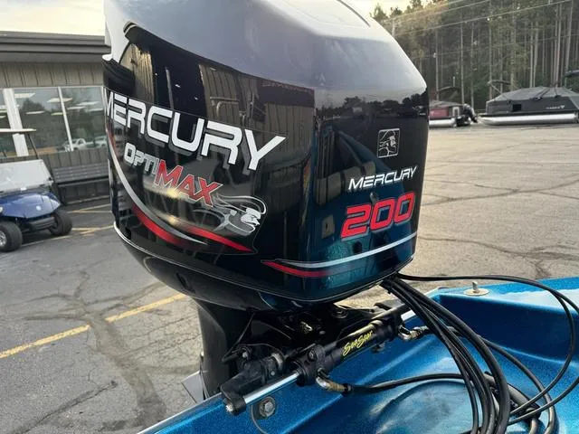 Slide: The Image of 1989 Hydrostream Vegas XT with Mercury OptiMax 200 engine in a parking lot. - 16