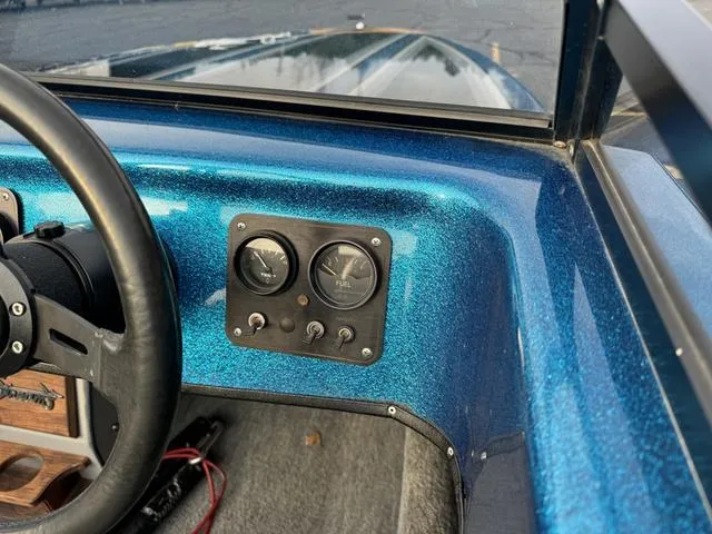 Slide: The Image of 1989 Hydrostream Vegas XT dashboard with blue metallic finish and gauges. - 19