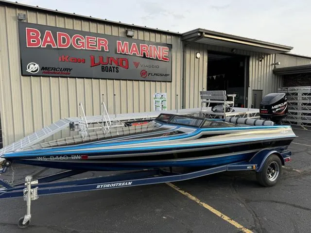 Slide: The Image of 1989 Hydrostream Vegas XT boat on trailer at Badger Marine dealership. - 2