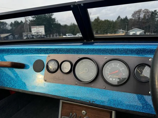 Slide: The Image of Dashboard of a 1989 Hydrostream Vegas XT boat with blue metallic finish and gauges. - 20