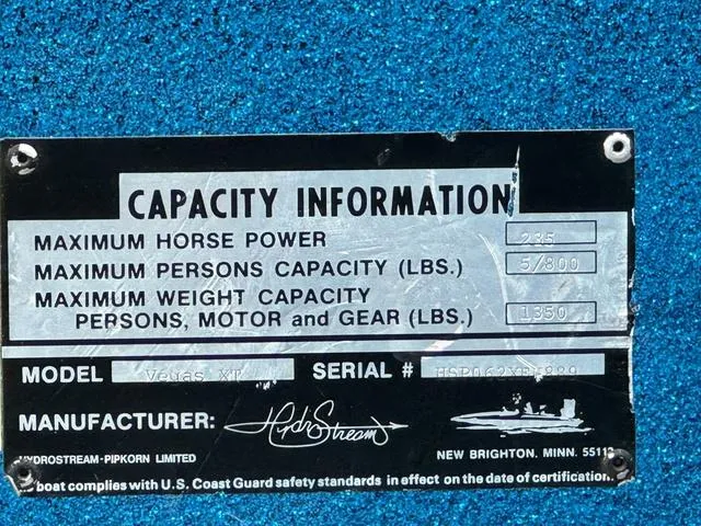 Slide: The Image of 1989 Hydrostream Vegas XT capacity plate detailing horsepower and weight limits. - 21