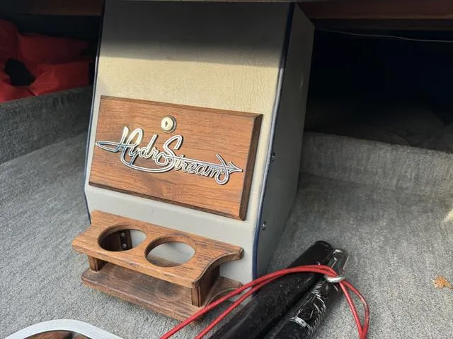 Slide: The Image of 1989 Hydrostream Vegas XT interior with wood panel and cup holders. - 22